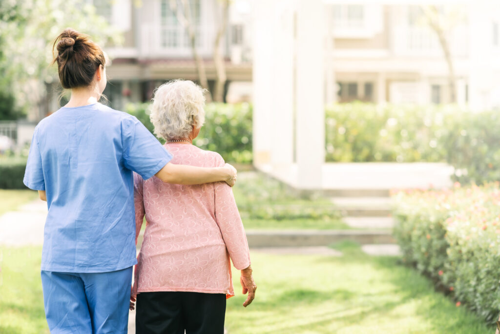 nurse-helping-patient-older-woman