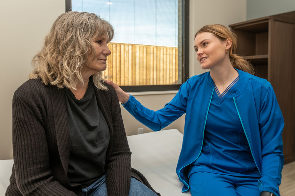Oceans healthcare staff helping a patient