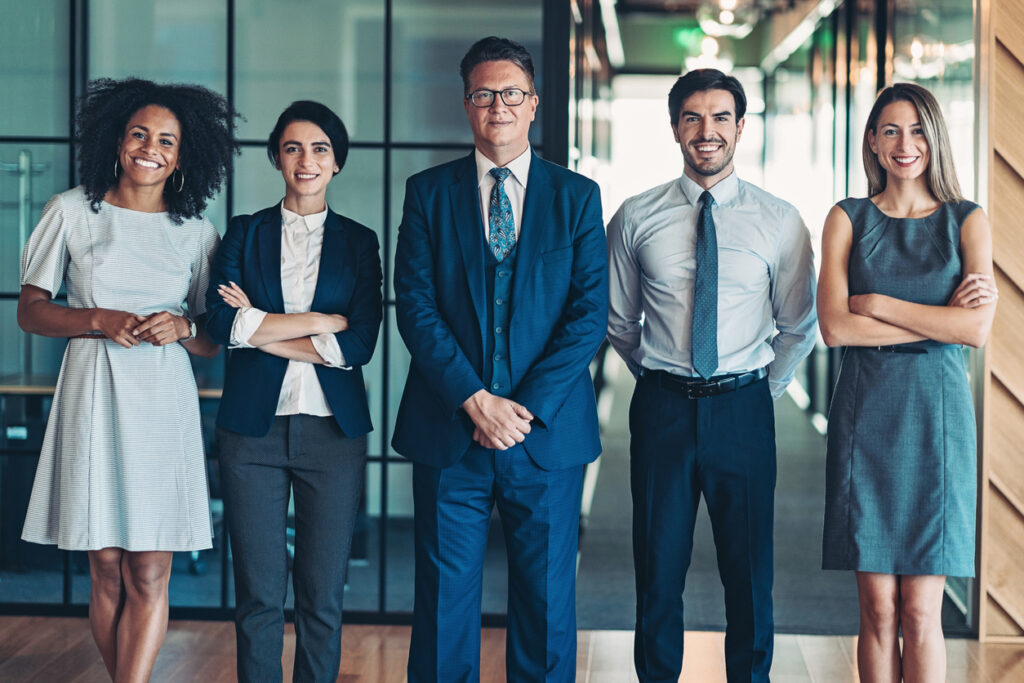 Mixed group of business persons standing side by side